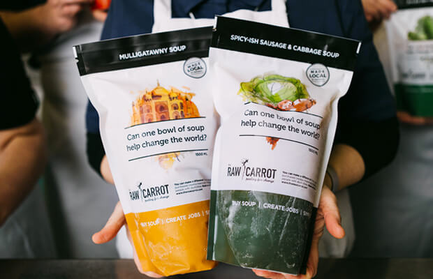 care_for_our_products An image of a person's hands holding two packets of soup. Along with text reading on the packets, "Can one bowl of soup help change the world?".